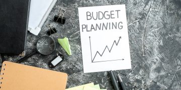 top-view-budget-planning-note-with-pens-gray-surface-job-copybook-school-student-business-work-college-money-budget
